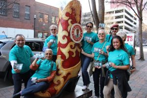 Volunteers take a quick photo during booklet distribution.